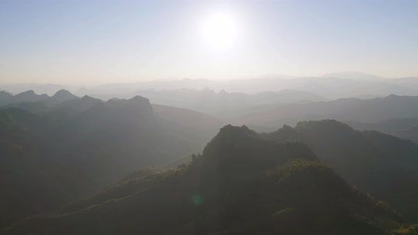 Aerial top view of forest trees and green mountain hills. Nature landscape background, Thailand.