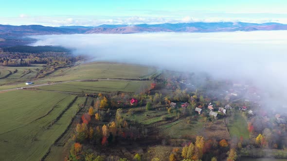 Flying Over a Village. Aerial Drone View of Early Morning Haze, Fog