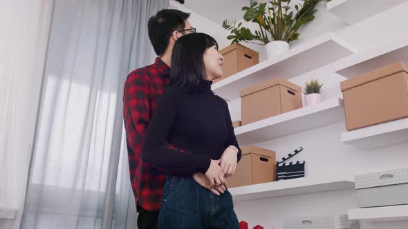 Young Happy Couple Moving in New Appartment