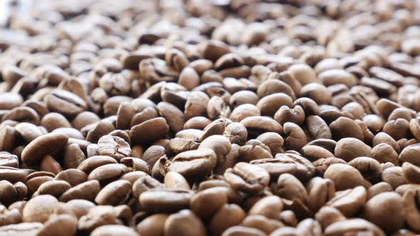 Coffee beans roasted and ready to be grinded slow tilting shallow DOF 4K 2160p UltraHD footage - Bac