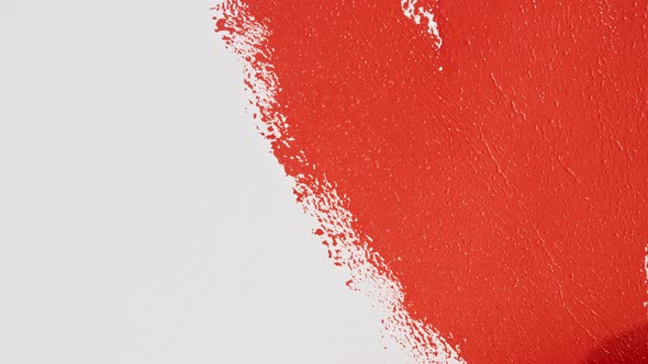 Red Acrylic Paint on a White Background