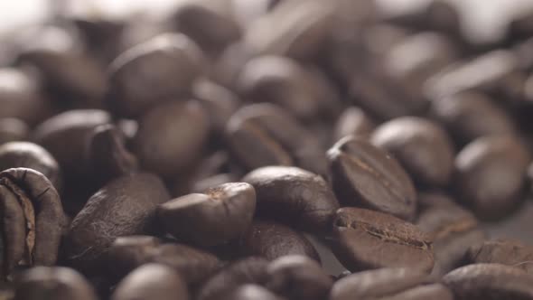 Fresh coffee beans background detailed macro panning shot