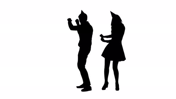 Guy and the Girl in Hats Dancing at a Party To the Birthday. White Background. Silhouette