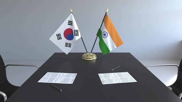 Flags of South Korea and India on the Table alt