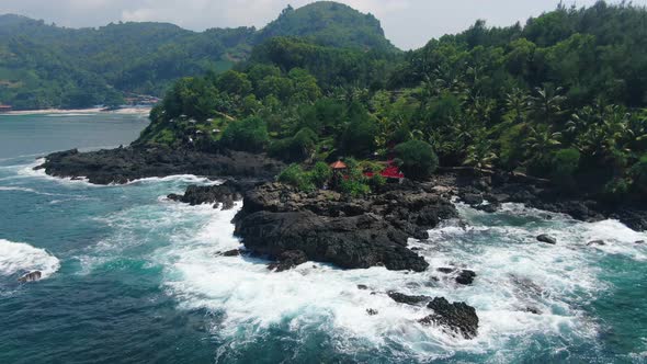 Aerial view on viewpoint on volcanic rock on Menganti coast, Java, Indonesia