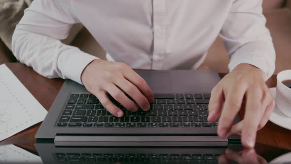 Freelancer Work on Laptop in a Coffee Shop