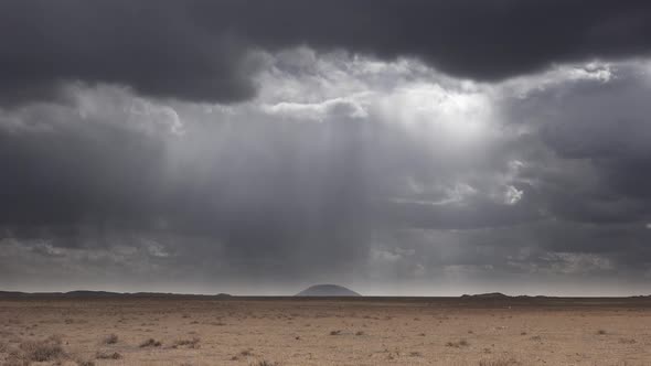 Dark Rain Storm Clouds Approaching in Desert