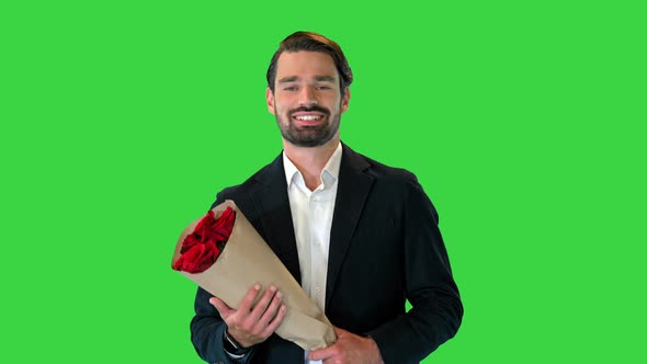 Handsome Man Walking To the Date with Bouquet of Roses on a Green Screen Chroma Key