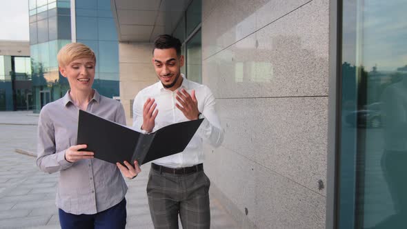 Two Multiracial Business Partners Caucasian Woman and Hispanic Man Entrepreneurs Workers Managers