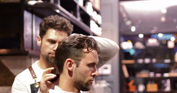 Man getting his hair trimmed with trimmer