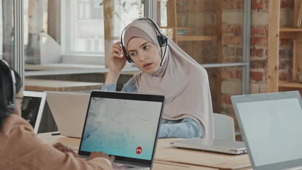 Tired Muslim Woman Working at Call Center