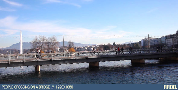 People Crossing On A Bridge