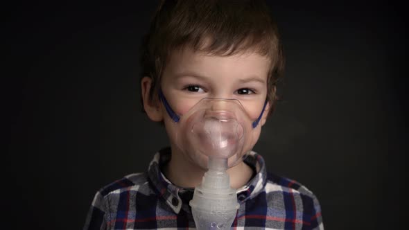 Footage Young Boy Inhaling Through Inhaler Mask