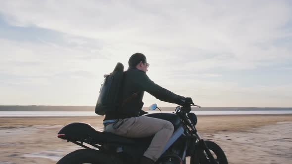 Motorcyclist Driving His Motorbike on the Road During Sunset Slow Motion