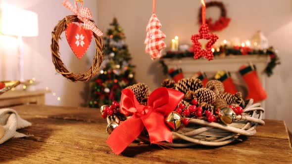 Grapevine wreath with red ribbon and pine cone