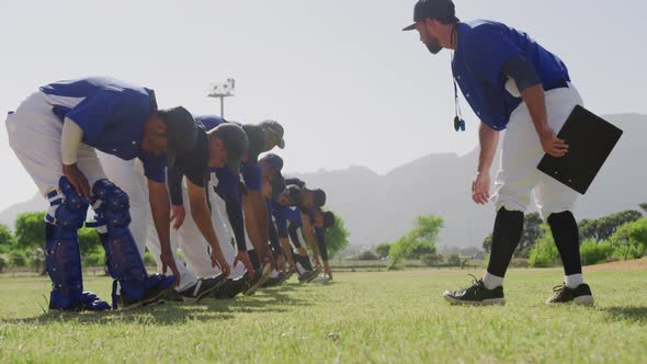 Baseball players stretching together