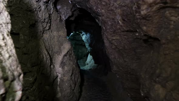 Speleology, cave, dungeon, dark tunnel, underground excavations. The old cave is formed by water