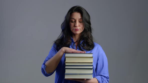 European Bored Mature Woman As Student on Grey Background Is Dissatisfied with Amount of Homework