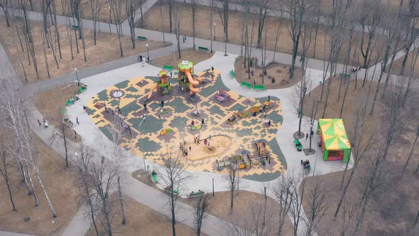 Playground with Swings Carousels and Sandbox During the Weekend  Aerial View