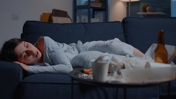 Unhappy Depressed Woman Crying Lying on Sofa Suffering From Insomnia