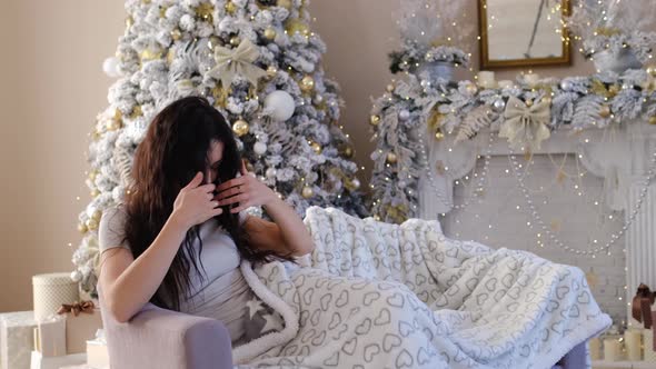 Positive Woman Indoors with Christmas Decoration