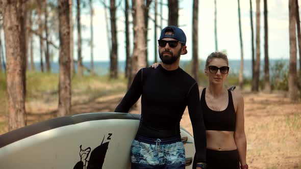 Couple After Swim Surfing Boat Fitness Workout With Oar. Travel SUP Water Tourism Holiday Vacation.