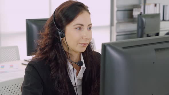 Business People Wearing Headset Working in Office