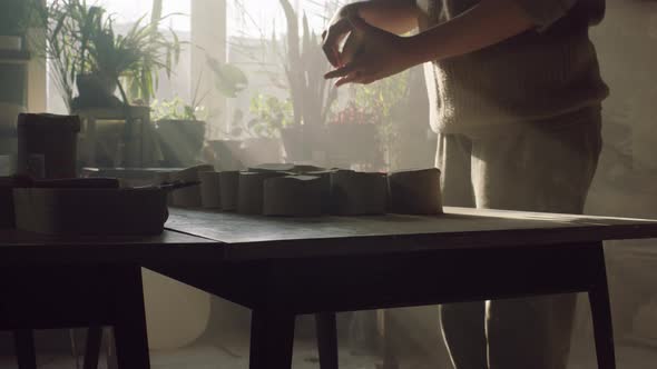 Woman Is Working With Piece of Clay