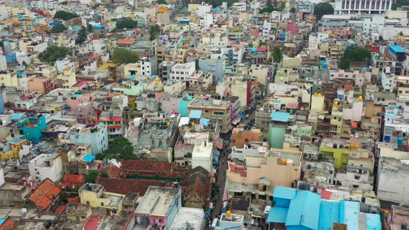 Flying over urban community toward lake in Bangalore India