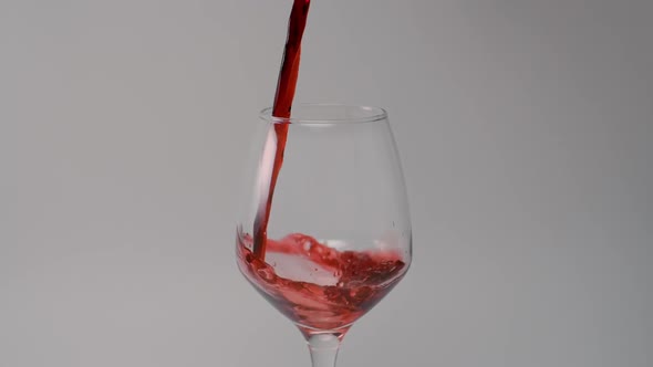 Red Wine Is Poured To the Glass in Slow Motion, Liquid in 240Fps, Alcohol Drink, Glass of Wine, Full