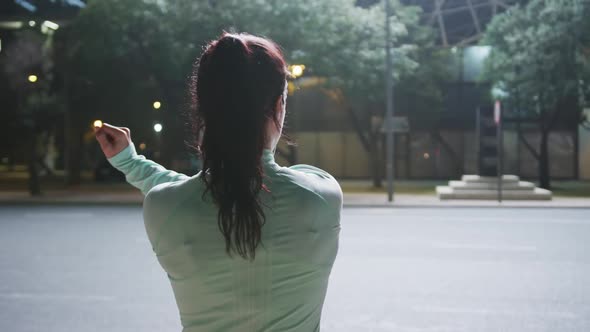 Young woman stretching before running