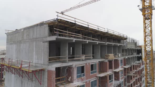Construction of a multi-storey building made of concrete, brick and glass 21