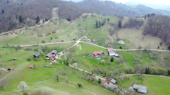 Top view, flying over idyllic villa area early in spring.