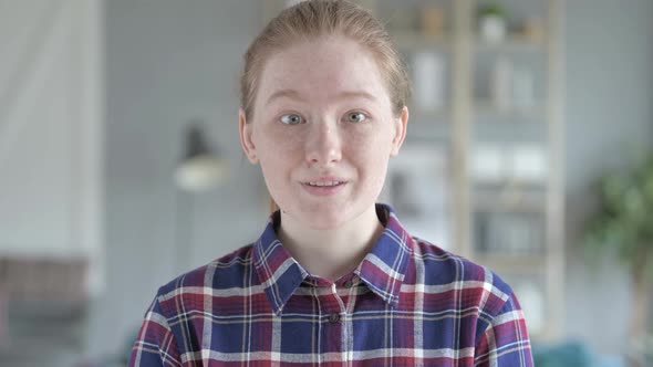 Close Up of Young Woman Showing Excitement By Hand Gesture