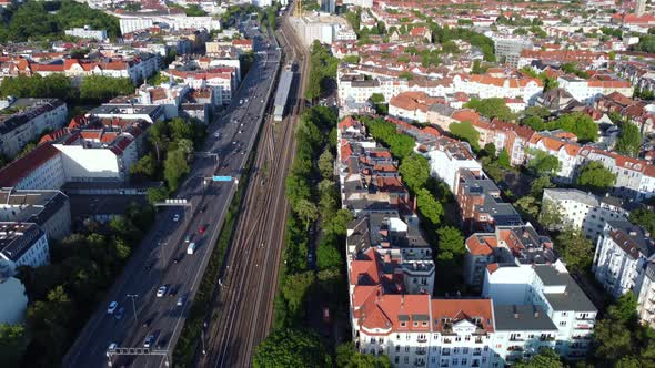 City center, summer, highway,  s-Bahn tracks.Buttery soft aerial view flight slowly tilt up drone f