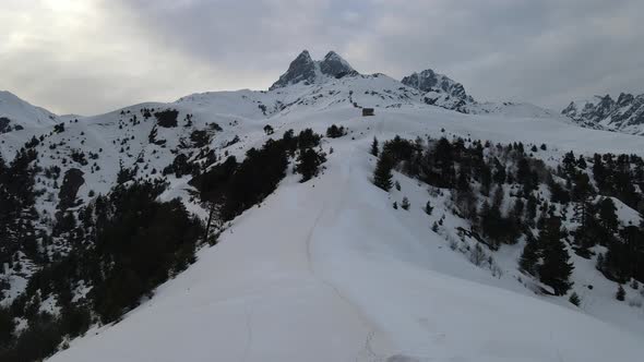 Drone aerial view on Mount Ushba. Mestia village, caucasus, Georgia.Sunset and snow.