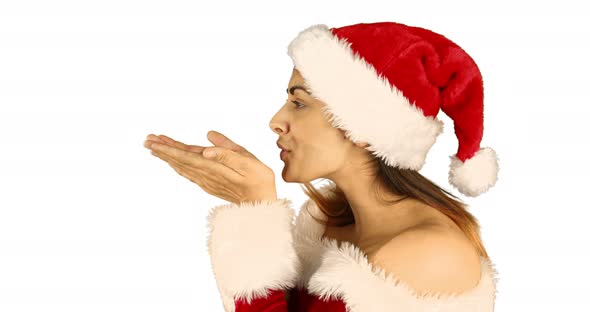 Sexy santa girl blowing over hands 4k