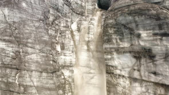 Waterfall coming from one of the Cracks in a large Glacier in Iceland