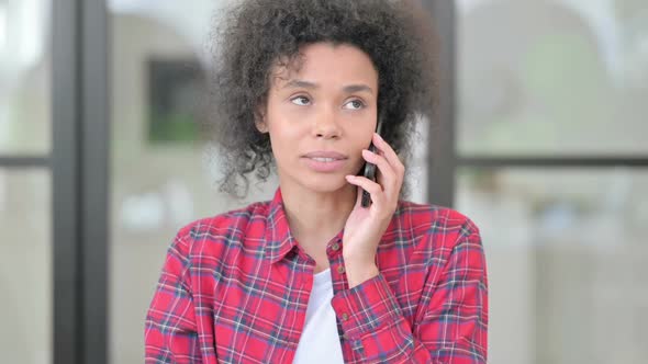 African Woman Talking on Phone