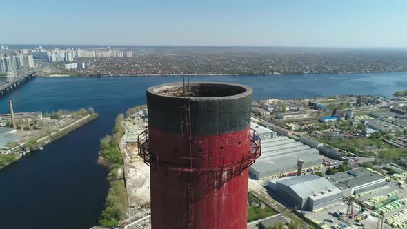 Aerial Drone View of Large Red and White Chimney Without Smoke at Sunny Day