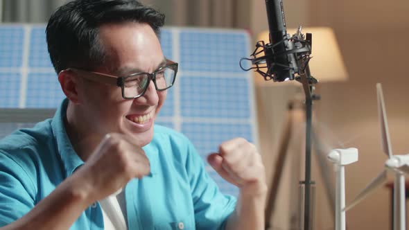 Close Up Of Asian Man Happy Succeed Testing The Wind  Turbine While Working Next To The Solar Cell