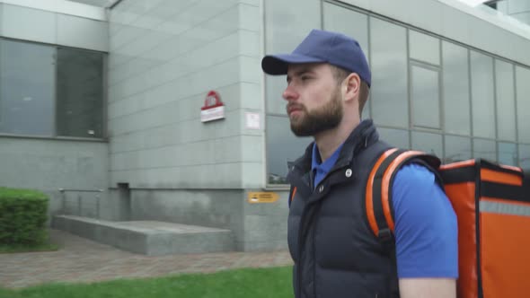 Courier with a Thermo Bag Delivers Food To the Office, the Process of Food Delivery, Food Delivery