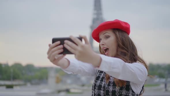 Beautiful young woman spending time in Paris.