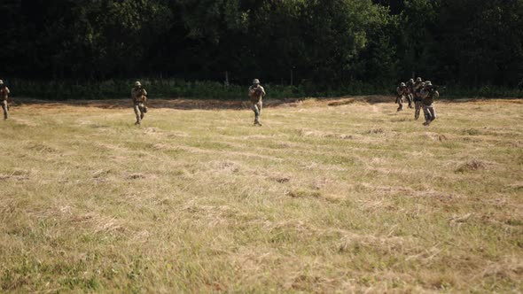 Group of Soldiers with Ammunition and Weapons on the Battlefield Attempting to Attack the Enemy