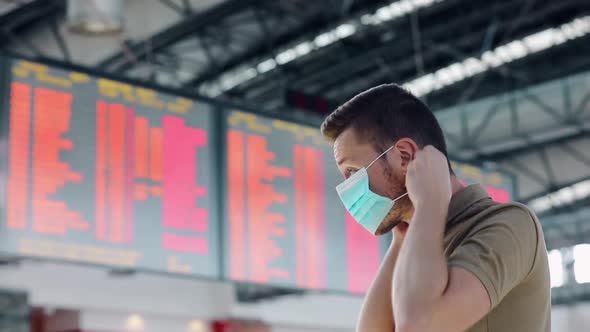Man wearing face mask at airport