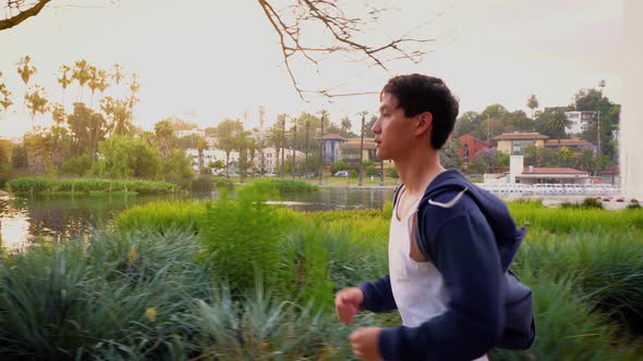 Young Asian man working out in a park in Los Angeles.