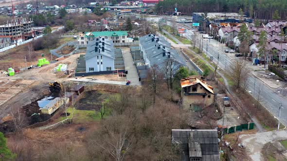 Aerial view of the road. Aerial view of the destroyed and burnt houses.