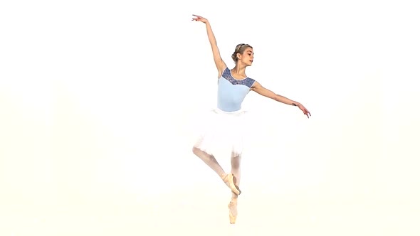 Graceful Ballerina in Ballet Pose on White, Slow Motion