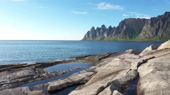 View on popular travel destination and Rock Davil’s Jaw in the sunny summer day, Norway,island Senja