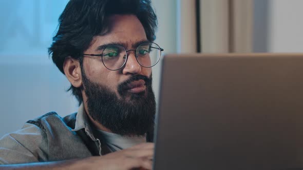 Closeup Pensive Busy Bearded Arabian Hispanic Indian 35s Man Looking at Laptop Screen Reading News
